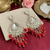 Tessara Silver-Plated Kundan Teardrop Earrings with Red Beaded Fringe