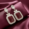 Tessara Gold-Plated Kundan Drop Earrings with Carved Maroon Stone