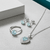 Tessara Silver-Plated Aqua Blue Baguette Heart Pendant Set with Ring