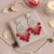 Tessara Silver-Plated Kundan Teardrop Earrings with Coral Red Beaded Fringe