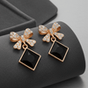 Tessara Gold-Plated Bow Drop Earrings with Black Square Stone