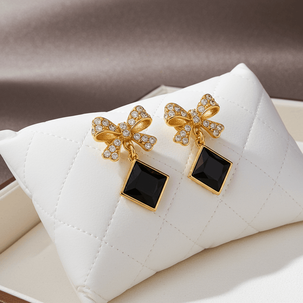 Tessara Gold-Plated Bowknot Drop Earrings with Black Square Stone