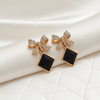Tessara Gold-Plated Bow Drop Earrings with Black Square Stone