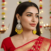 Tessara Silver-Toned Kundan Studded Drop Earrings with Yellow Beaded Drops