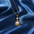 Tessara Gold-Plated White AD-Studded Pearl Sunburst Pendant