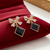 Tessara Gold-Plated Bow Drop Earrings with Black Square Stone
