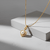 Tessara Gold-Plated White AD-Studded Pearl Heart Pendant