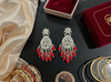 Silver-Plated Kundan Earrings with Red Beads -by Tessara